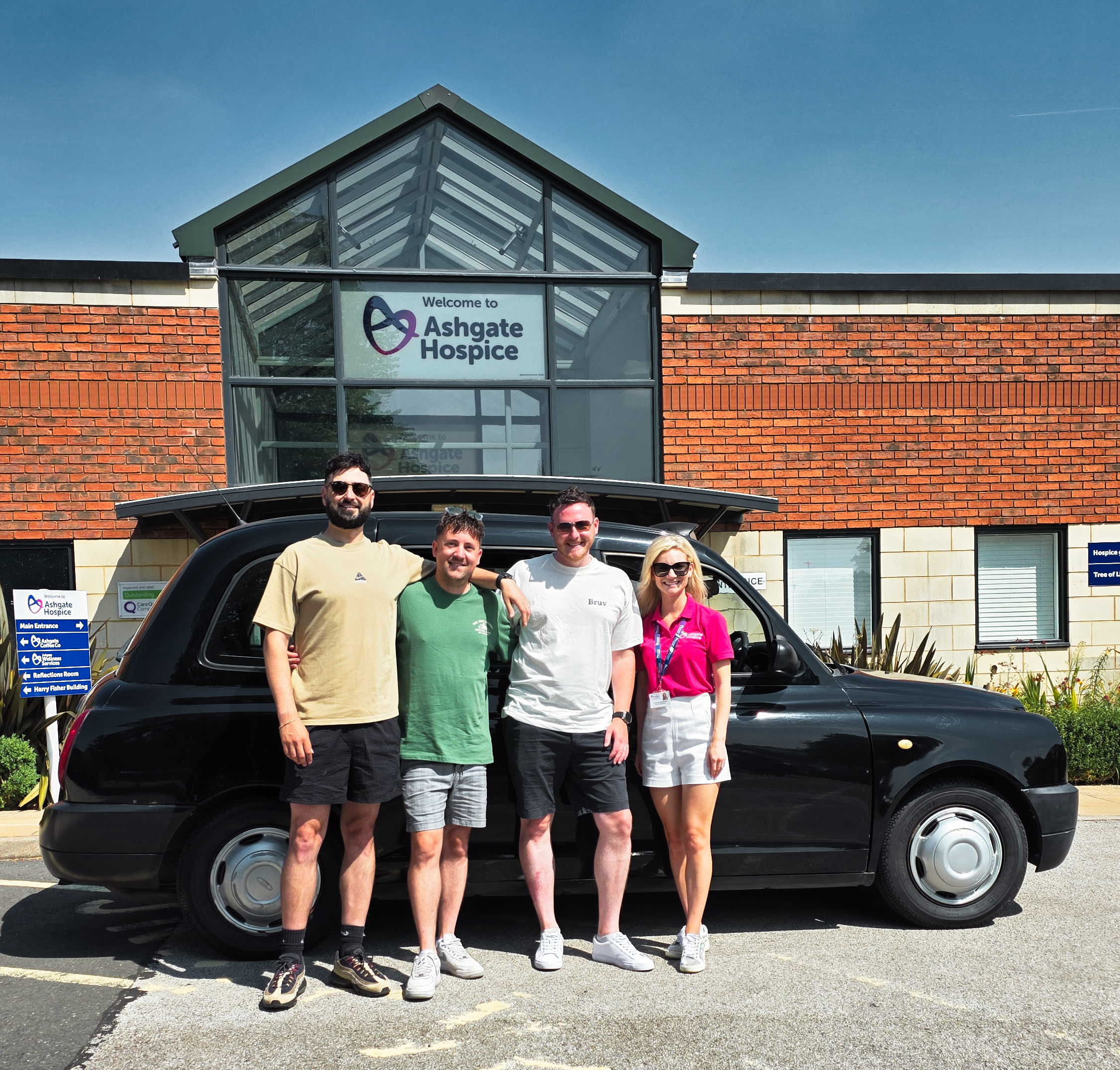 The Highland Hackney team with the taxi outside Ashgate Hospice