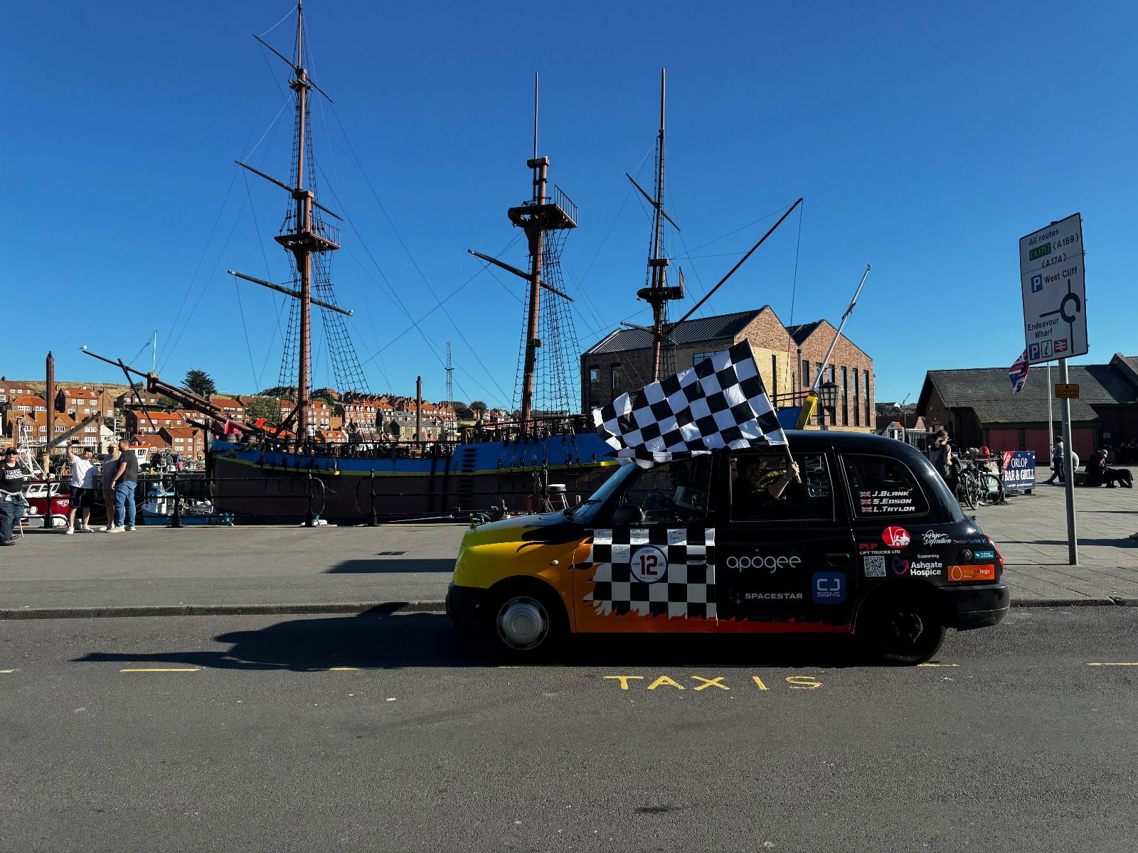 Take a team selfie at the HMS Endeavour.
