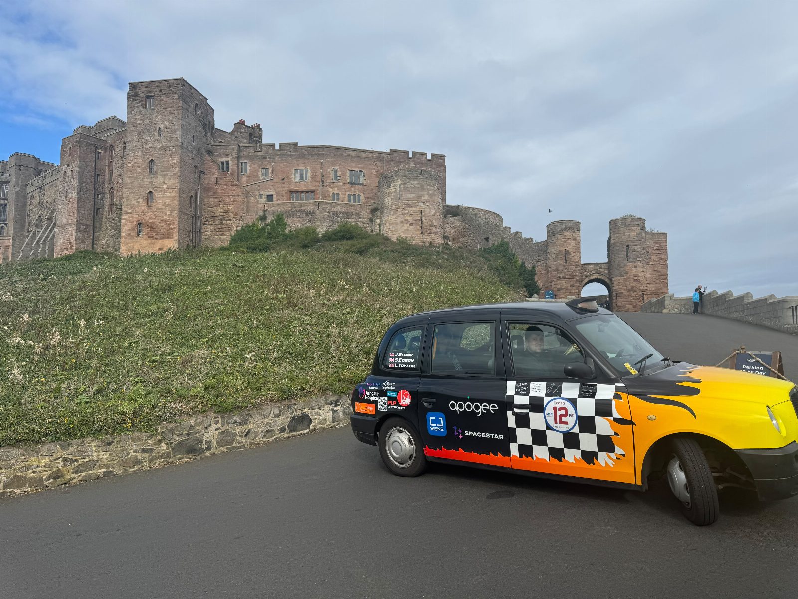 Take a team selfie at Bamburgh Castle.